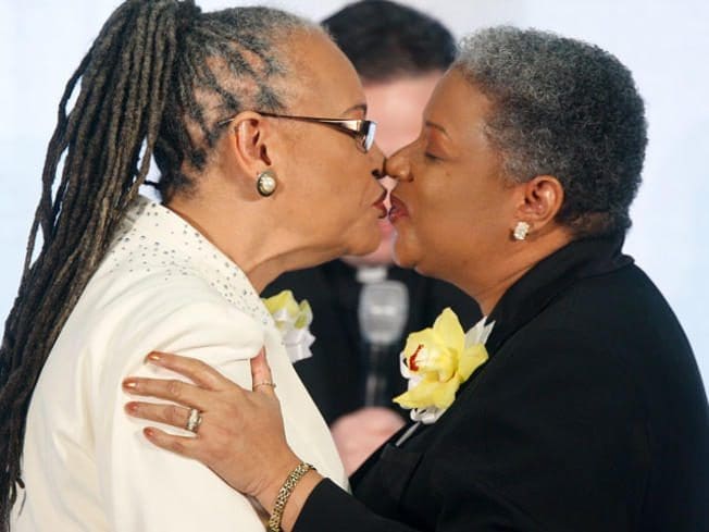 Older black lesbians kissing (photo by Alex Wong, Getty Images)
