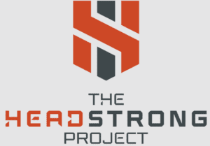 The logo for the Headstrong Project. There is a dark red-orange and black logo above the words The Headstrong Project. Head in Headstrong is dark red-orange while the other text is black.