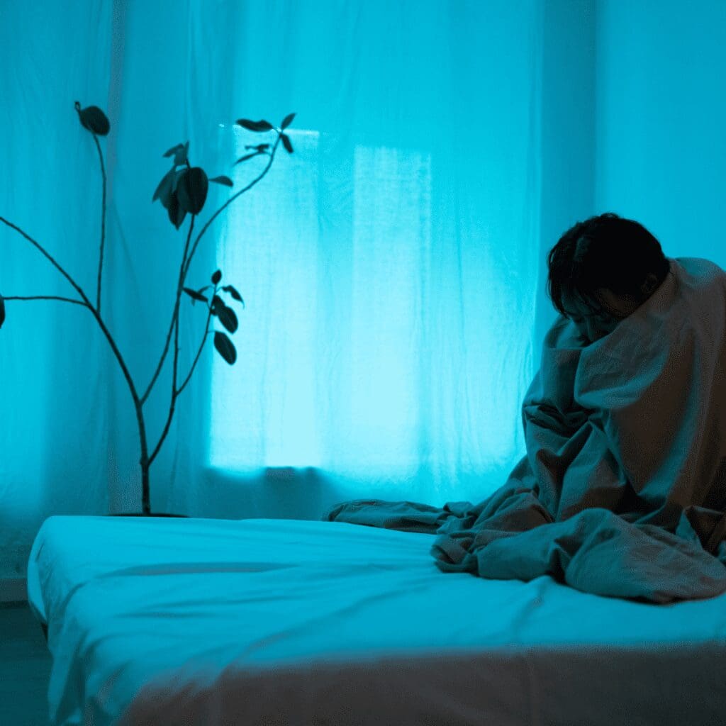 Person in bed with depression