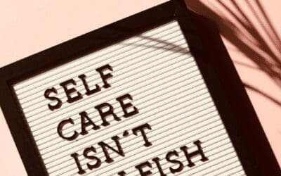 Sign stating self care isn't selfish as tip for mental health management