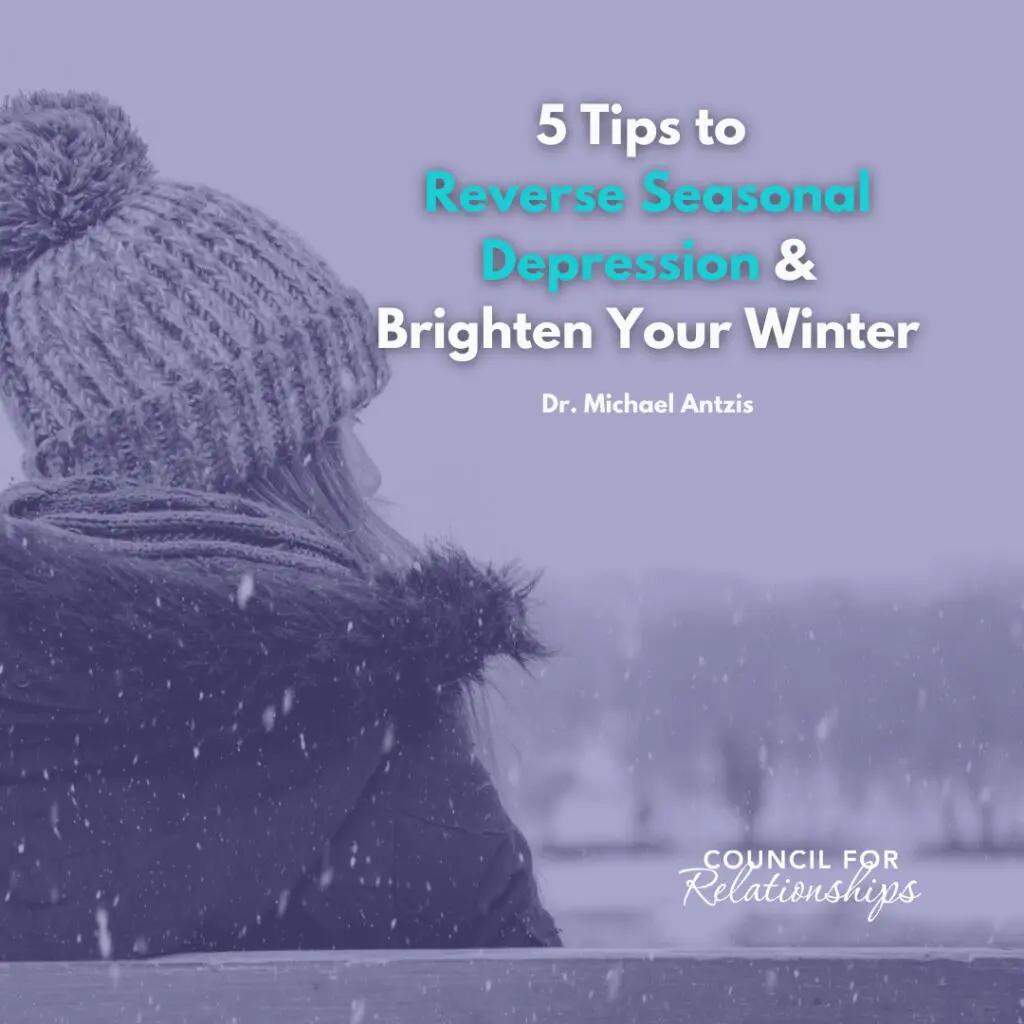 A person dressed in winter clothing, including a knit hat and scarf, sits on a bench in a snowy outdoor setting, looking into the distance. The image features the title text, “5 Tips to Reverse Seasonal Depression & Brighten Your Winter” by Dr. Michael Antzis, with the Council for Relationships logo in the bottom right corner.