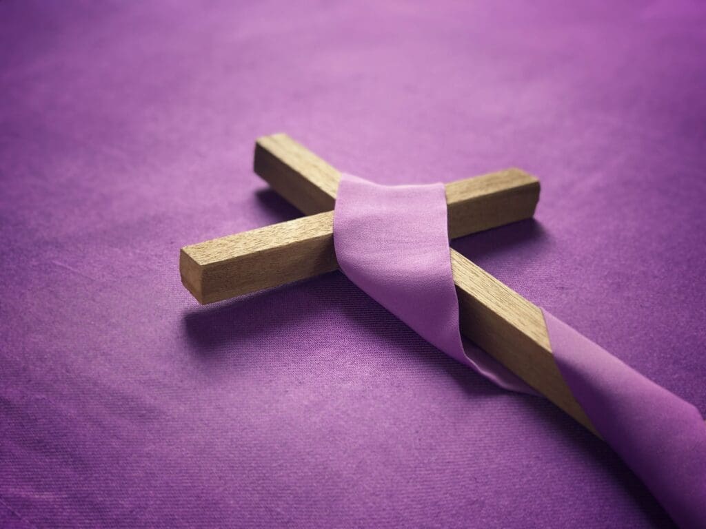 Christian crucifix wrapped in a purple cloth,