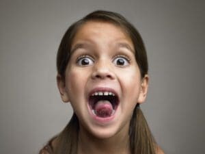 A child with her mouth open.